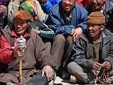 Mustang Lo Manthang Tiji Festival Day 3 04-1 Men Twirling Prayer Wheels and Counting Mantras On Beads